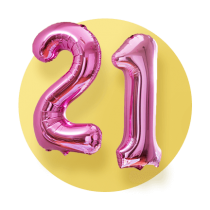 Two shiny pink mylar balloons for a 21st birthday. One 2 balloon and one 1 balloon in front of a yellow gradient circle.