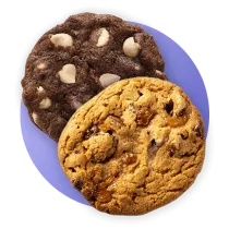 Chocolate cookie with white morsels on top of a chocolate chip cookie on a purple circle.