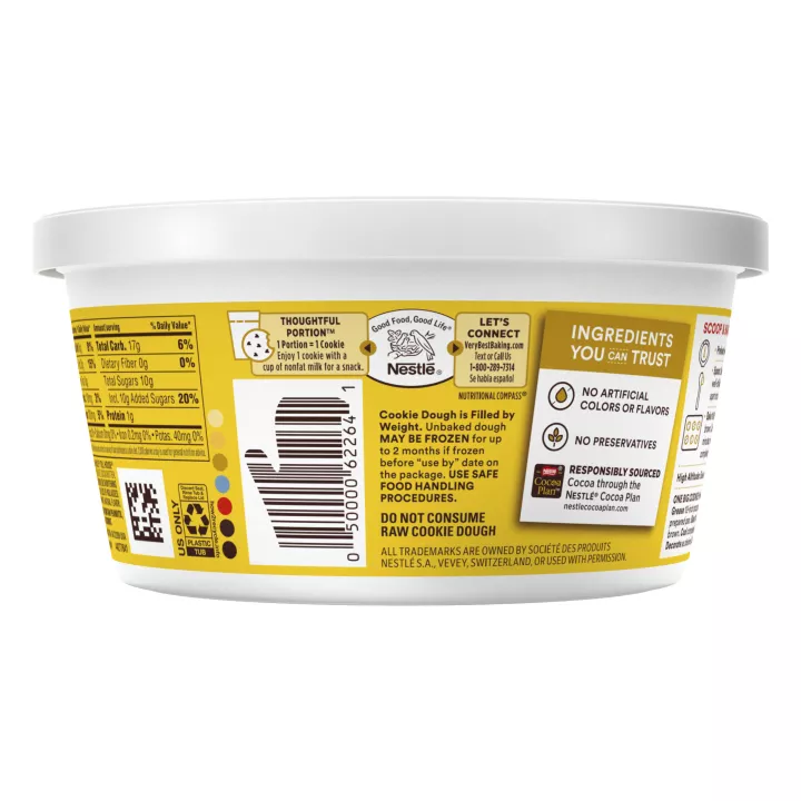 Right side view of a white tub with a yellow and red label that reads "chocolate chip cookie dough", the nutrition label, and two chocolate chip cookies.