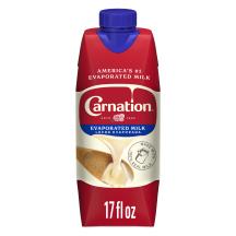 Front Center view of NESTLE CARNATION Evaporated Milk 17oz Tetra Carton NET / NETO 17 fl oz (1 pt 1 fl oz) 502 mL product.